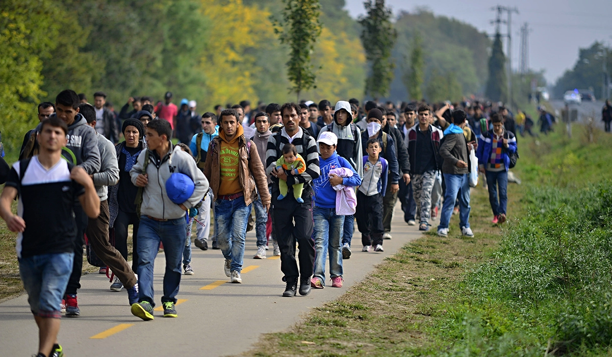 Crowd of people on a small road, istock Radek Prozyck