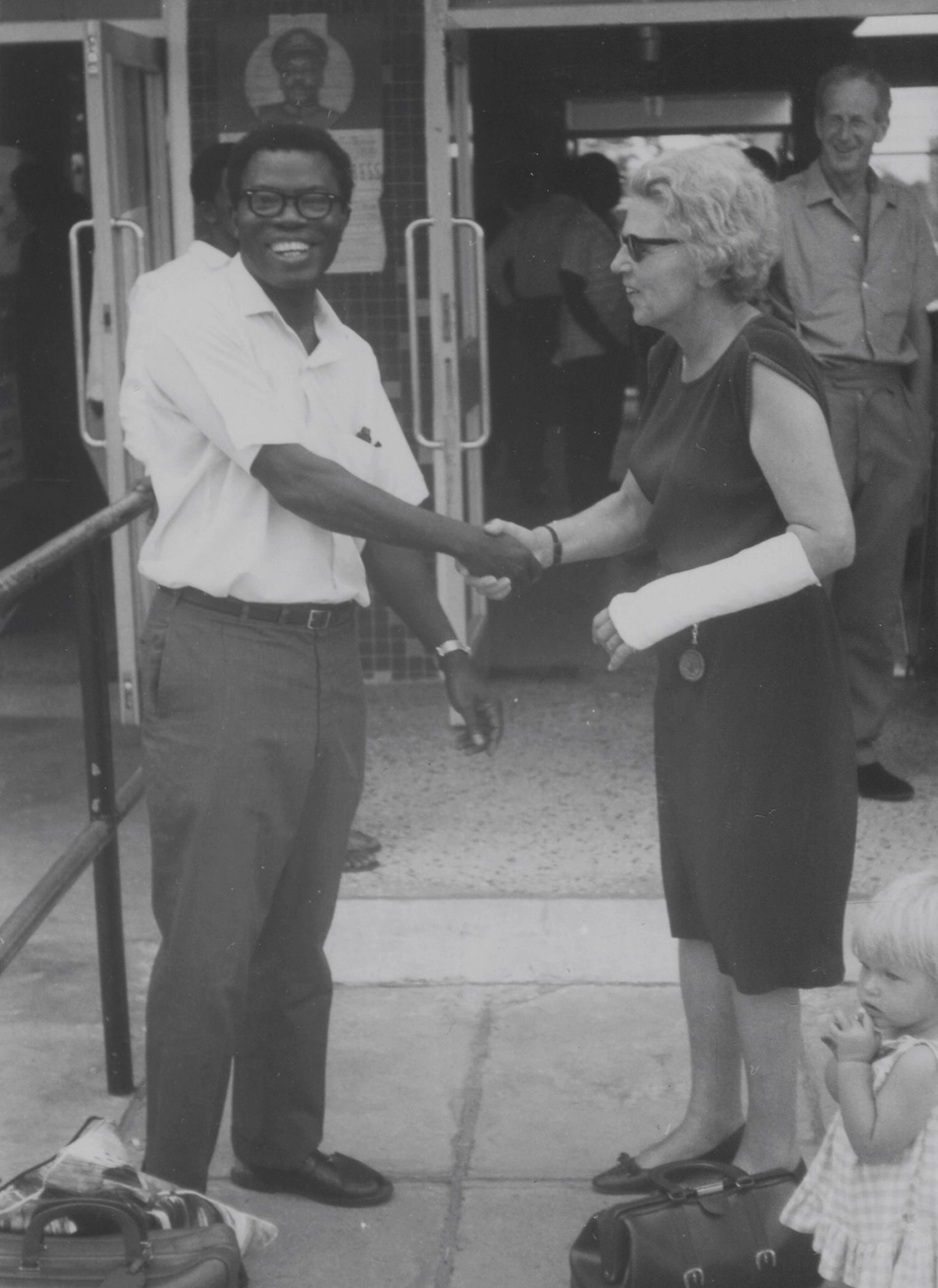 Harlander meeting Dr. H.M.A. Onitiri. They're shaking hands.