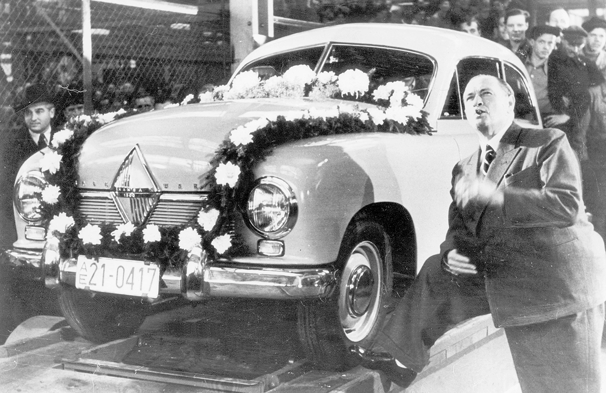 Automobile industrialist Carl Friedrich Wilhelm Borgward in front of the first produced Borgward model, the 'Hansa 1500', at the factory in Bremen; Credit dpa/Süddeutsche Zeitung Photo