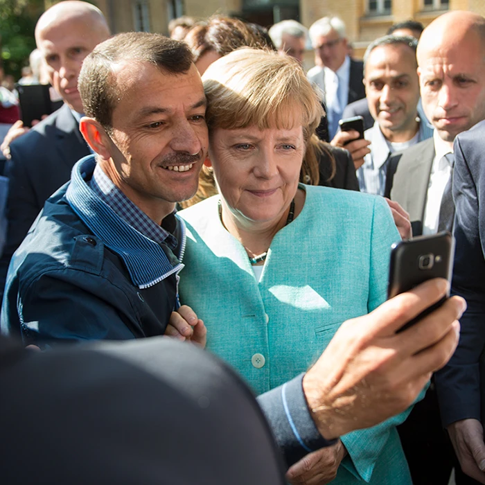 Angela Merkel taking a selfie with a refugee, picture alliance / dpa | Bernd Von Jutrczenka