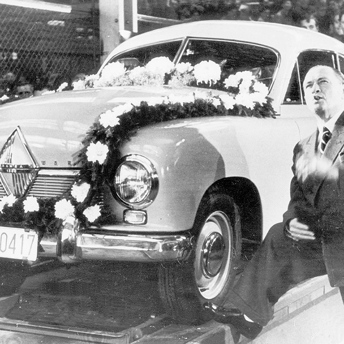 Automobile industrialist Carl Friedrich Wilhelm Borgward in front of the first produced Borgward model, the 'Hansa 1500', at the factory in Bremen; Credit dpa/Süddeutsche Zeitung Photo